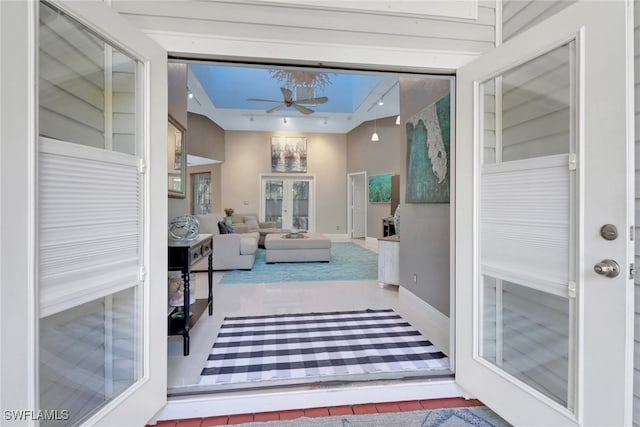 sunroom / solarium with french doors and ceiling fan