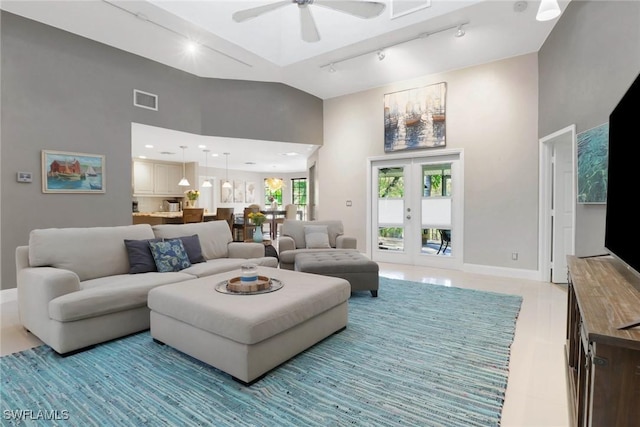 living room featuring track lighting, high vaulted ceiling, french doors, and ceiling fan