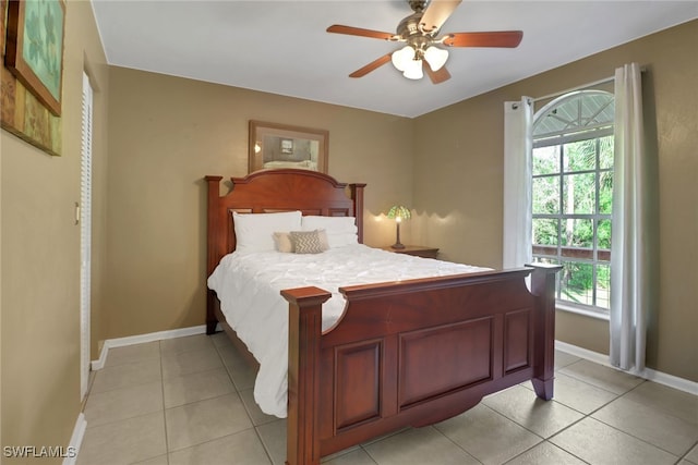 bedroom with light tile patterned flooring and ceiling fan