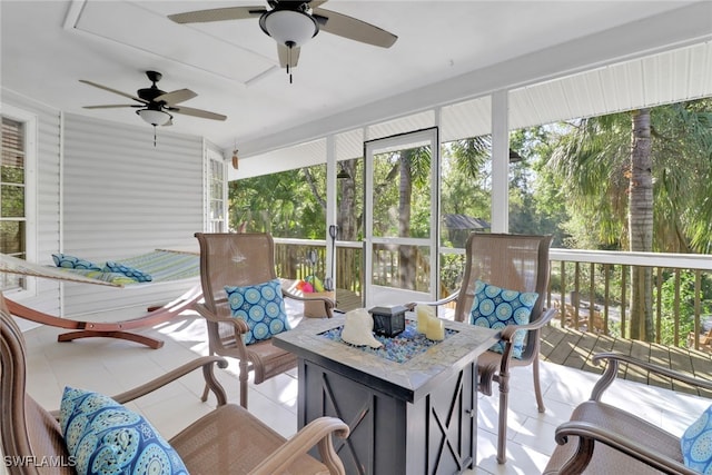 sunroom / solarium with ceiling fan