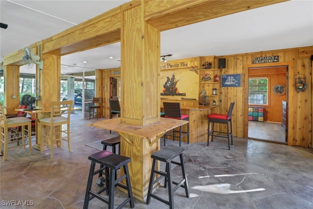 dining space with wooden walls