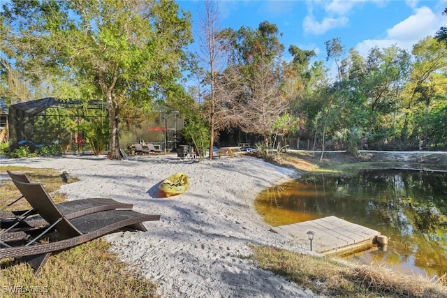 view of community with a water view