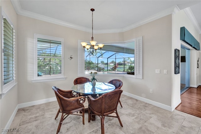 dining area featuring plenty of natural light, a chandelier, and ornamental molding