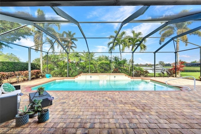 view of swimming pool with a patio and glass enclosure