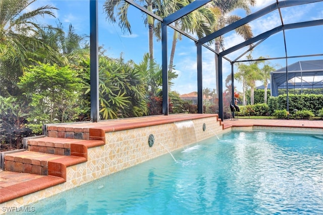 view of pool featuring a lanai and pool water feature