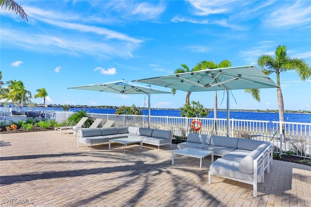 view of patio / terrace featuring outdoor lounge area and a water view