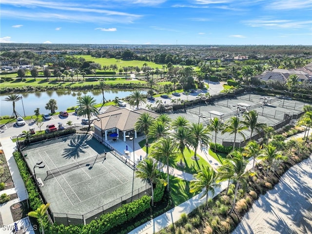 birds eye view of property with a water view