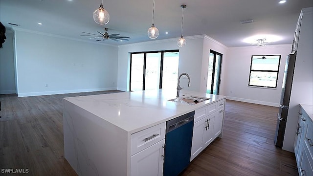 kitchen featuring ceiling fan, a kitchen island with sink, sink, white cabinets, and black dishwasher