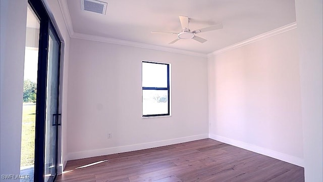 empty room with hardwood / wood-style floors, ceiling fan, and crown molding