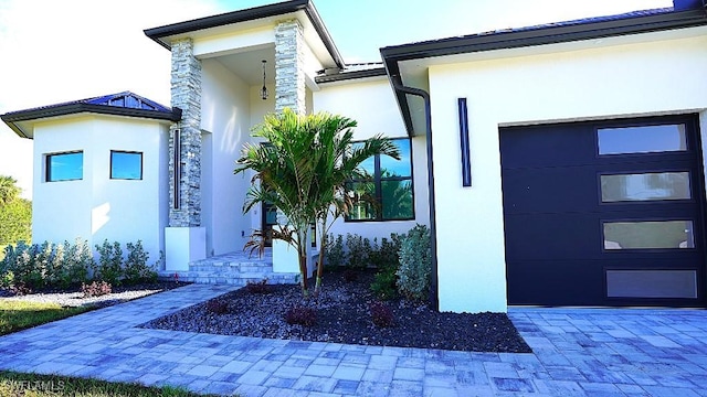 doorway to property featuring a garage