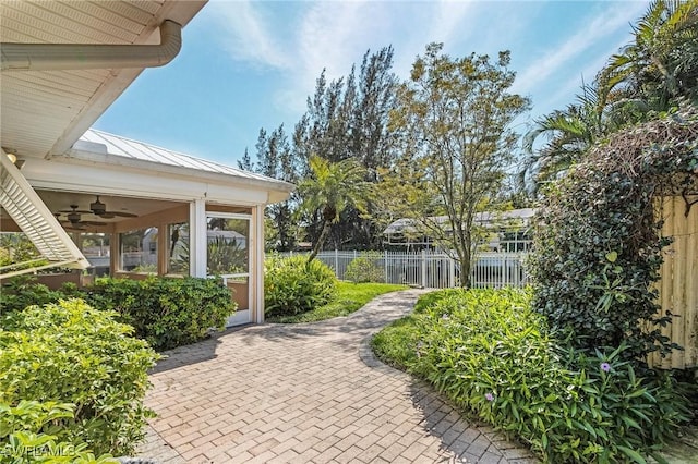 view of property's community featuring fence