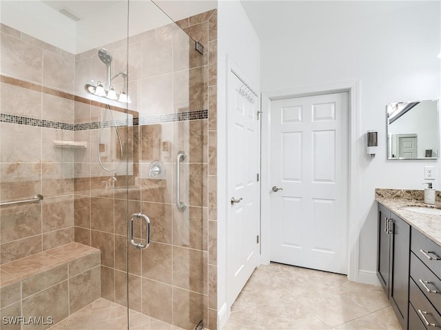 bathroom featuring vanity, tile patterned floors, and walk in shower