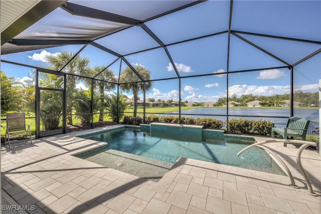 view of pool featuring a patio, a water view, and a lanai