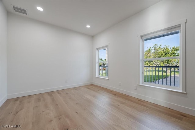 spare room with light wood-type flooring