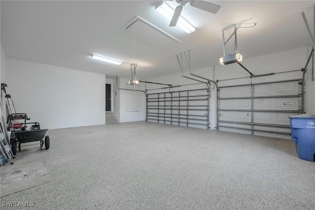 garage featuring ceiling fan and a garage door opener