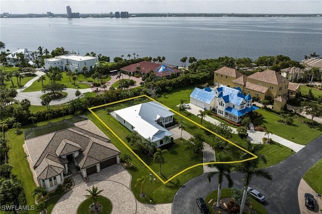 birds eye view of property featuring a water view