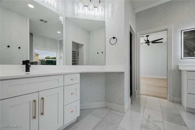 bathroom featuring tile patterned floors, ceiling fan, and vanity