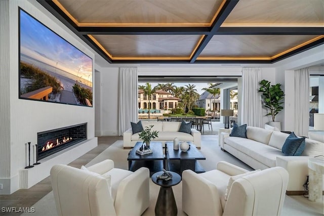 interior space with beamed ceiling, hardwood / wood-style floors, a wealth of natural light, and coffered ceiling