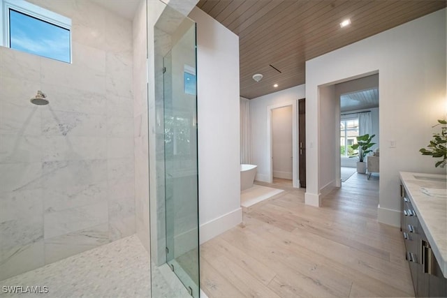 bathroom with vanity, hardwood / wood-style flooring, separate shower and tub, and wooden ceiling