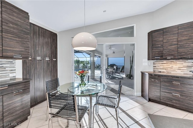 dining room featuring ceiling fan and light tile patterned floors