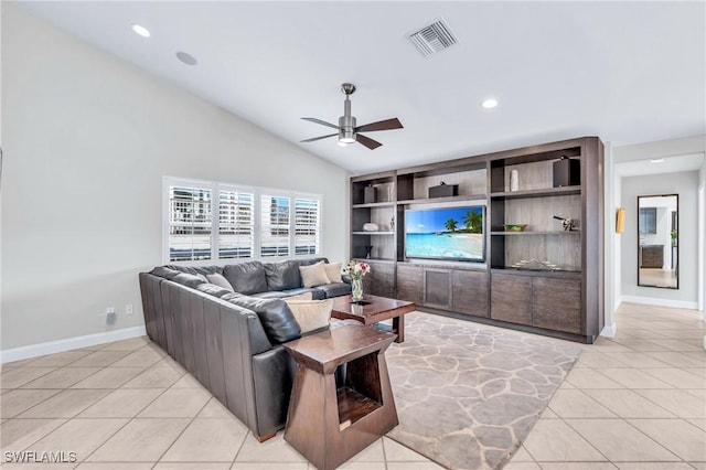 living room with ceiling fan, light tile patterned floors, and vaulted ceiling