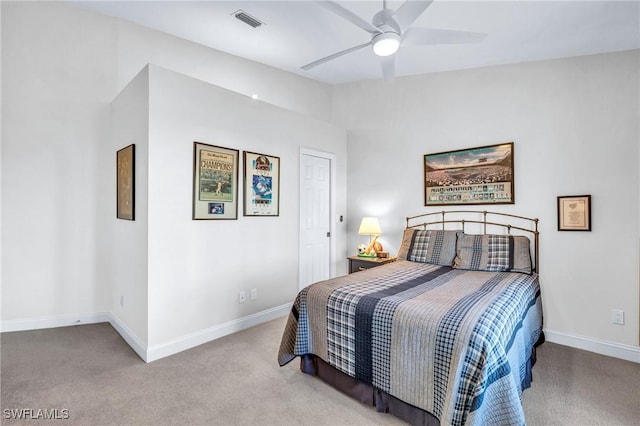 bedroom with ceiling fan and light carpet