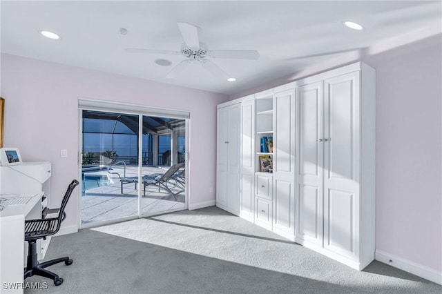 office area with light carpet and ceiling fan