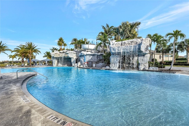 view of swimming pool featuring pool water feature