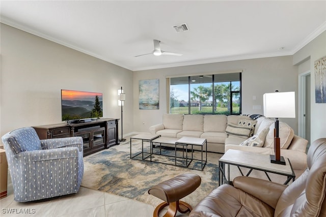 tiled living room with ceiling fan and crown molding