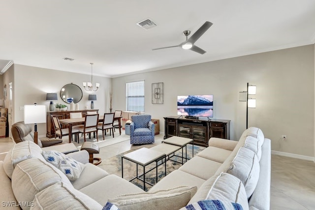 living room with ceiling fan with notable chandelier and crown molding