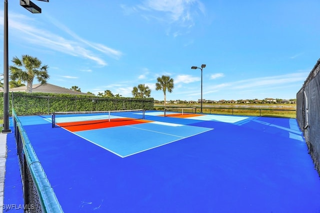 view of sport court featuring basketball hoop