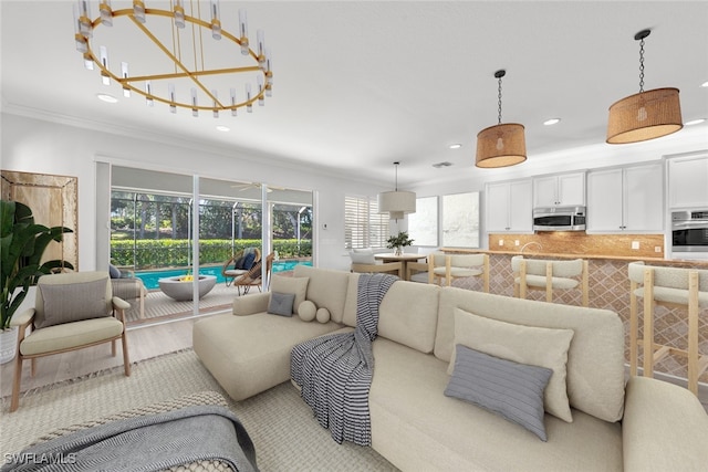 living room featuring light hardwood / wood-style floors and ornamental molding