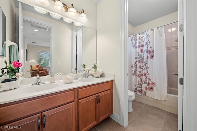 full bathroom featuring tile patterned floors, shower / bath combination with curtain, toilet, and vanity