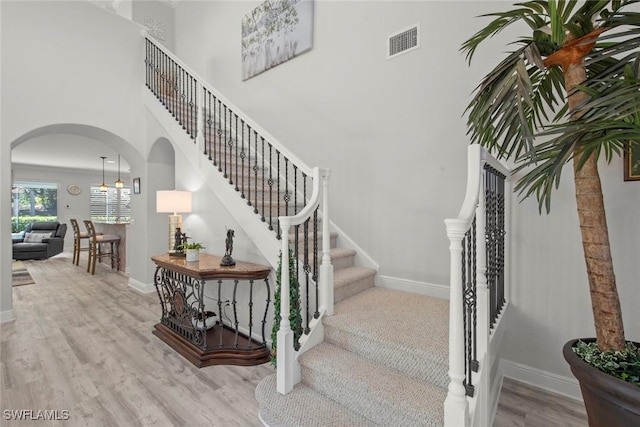 stairs with wood-type flooring