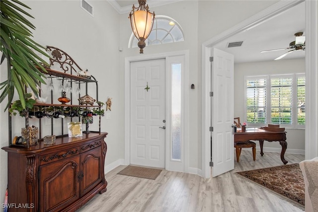 entryway featuring light wood-type flooring and ceiling fan