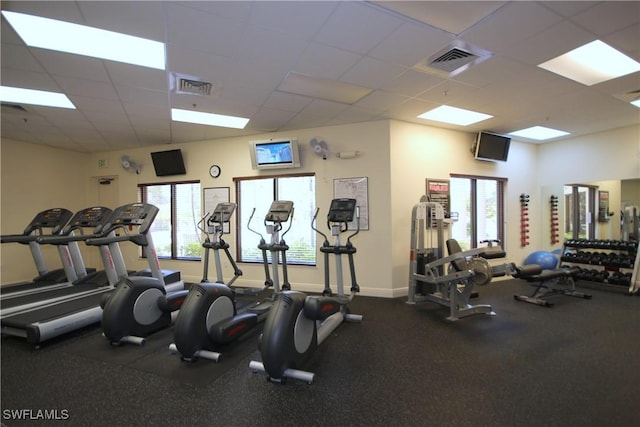 workout area featuring a drop ceiling