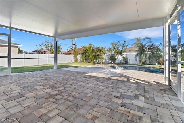 view of patio / terrace with a fenced in pool