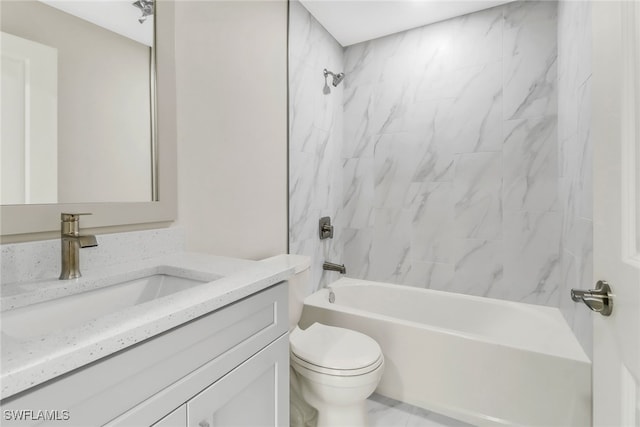 full bathroom featuring vanity, tiled shower / bath combo, and toilet