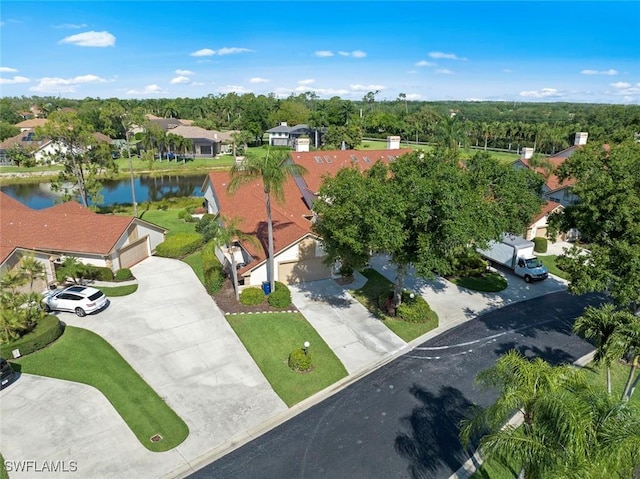 bird's eye view featuring a residential view and a water view