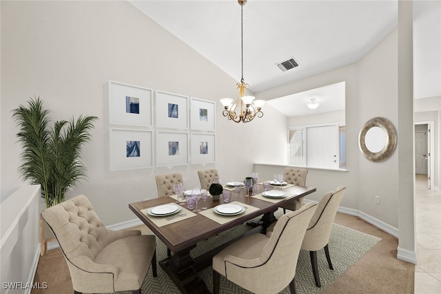 carpeted dining area featuring a chandelier and lofted ceiling