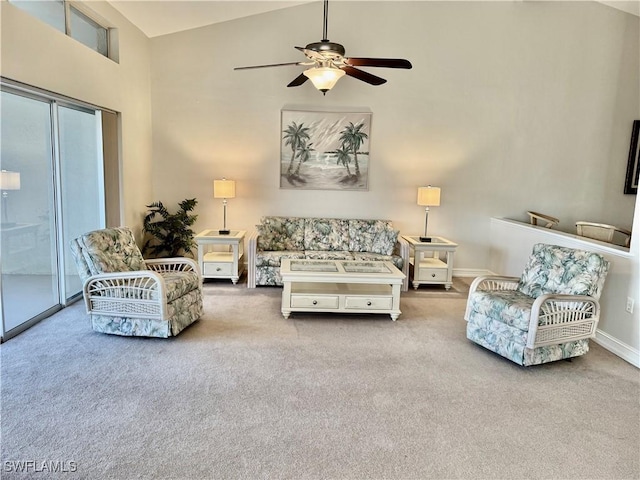 20110 Golden Panther Dr Unit 4, Estero, FL 33928 - living area featuring carpet floors, ceiling fan, baseboards, and high vaulted ceiling