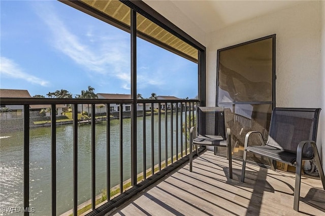 sunroom / solarium with a water view