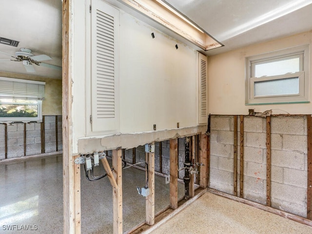 interior space featuring ceiling fan