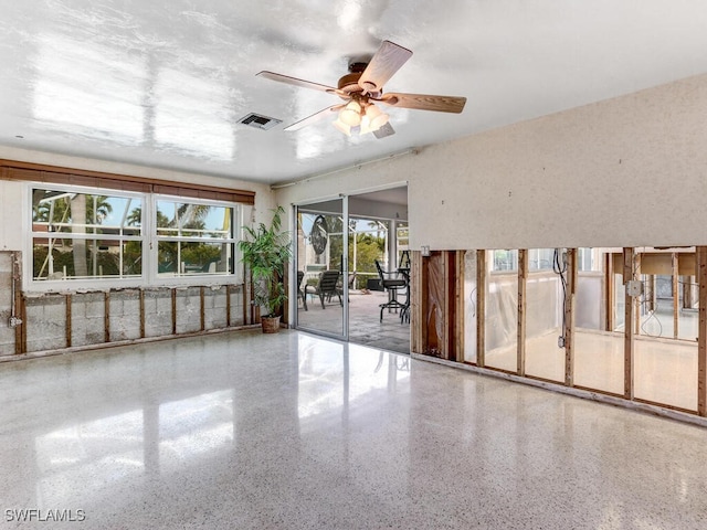 unfurnished room with ceiling fan