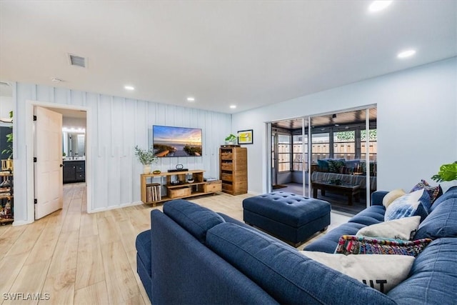 living room with light hardwood / wood-style flooring