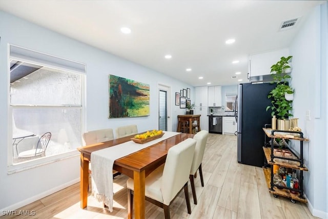 dining space with light wood-type flooring