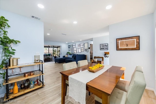 dining area with light wood-type flooring