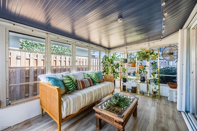 sunroom / solarium featuring lofted ceiling and wooden ceiling