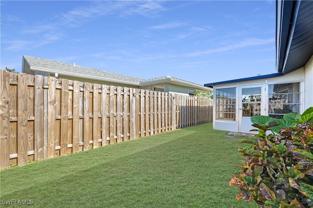 view of yard featuring a sunroom