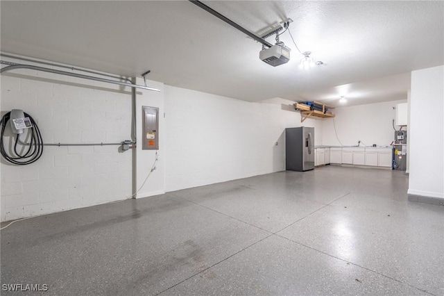 garage with electric panel, stainless steel fridge with ice dispenser, water heater, and a garage door opener